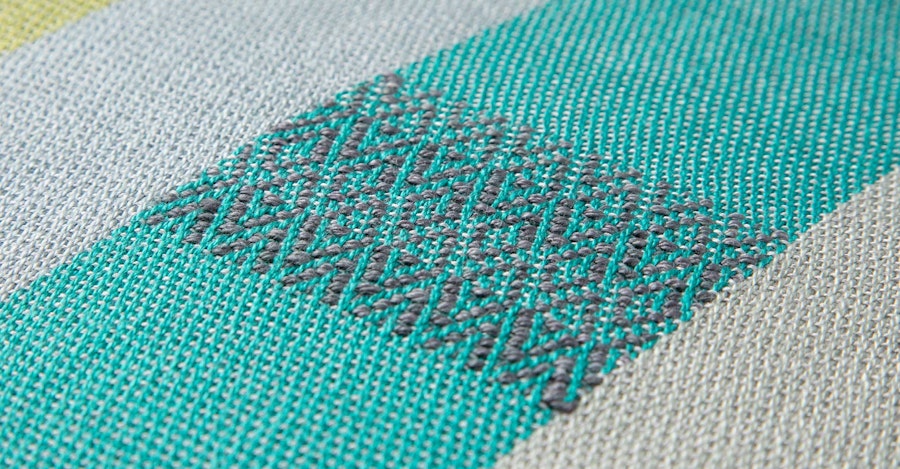Patterned Inlay on a Plain-Weave Background Image